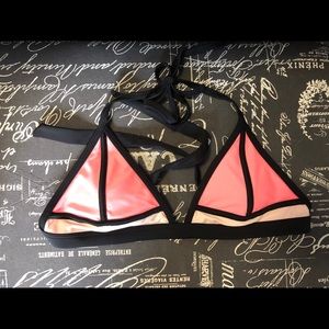 Pink and black bathing suit top